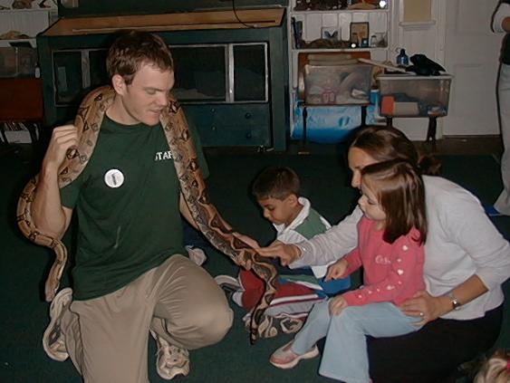Larson shows students snake - The Larson Lab @ NCSU - College of Natural Resources at NC State University